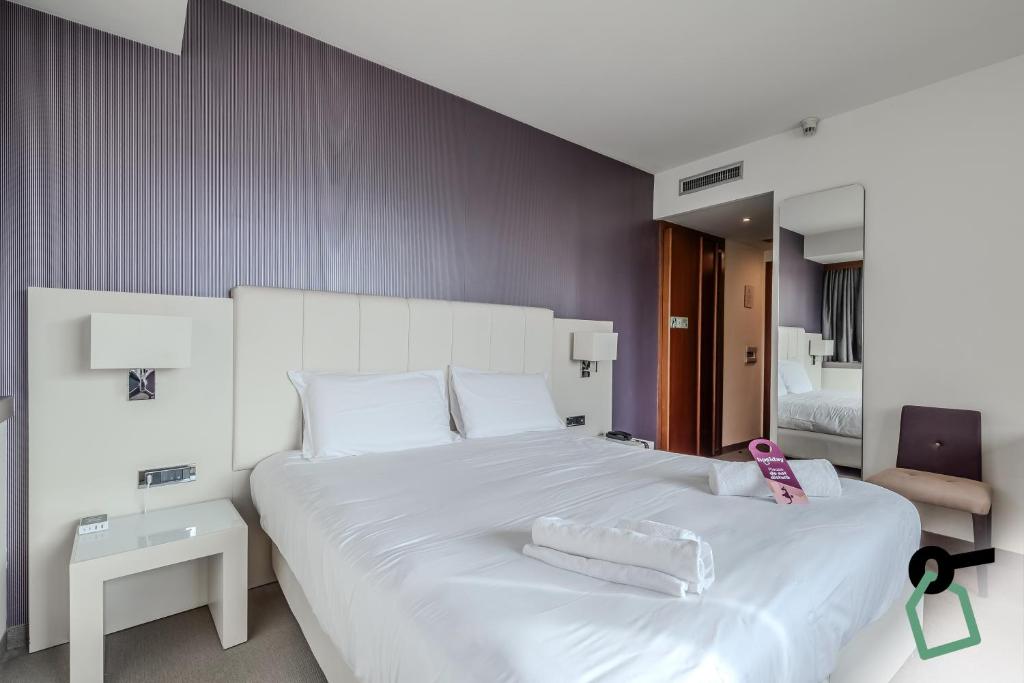 Postel nebo postele na pokoji v ubytování HOTIDAY Room Collection - Trapani