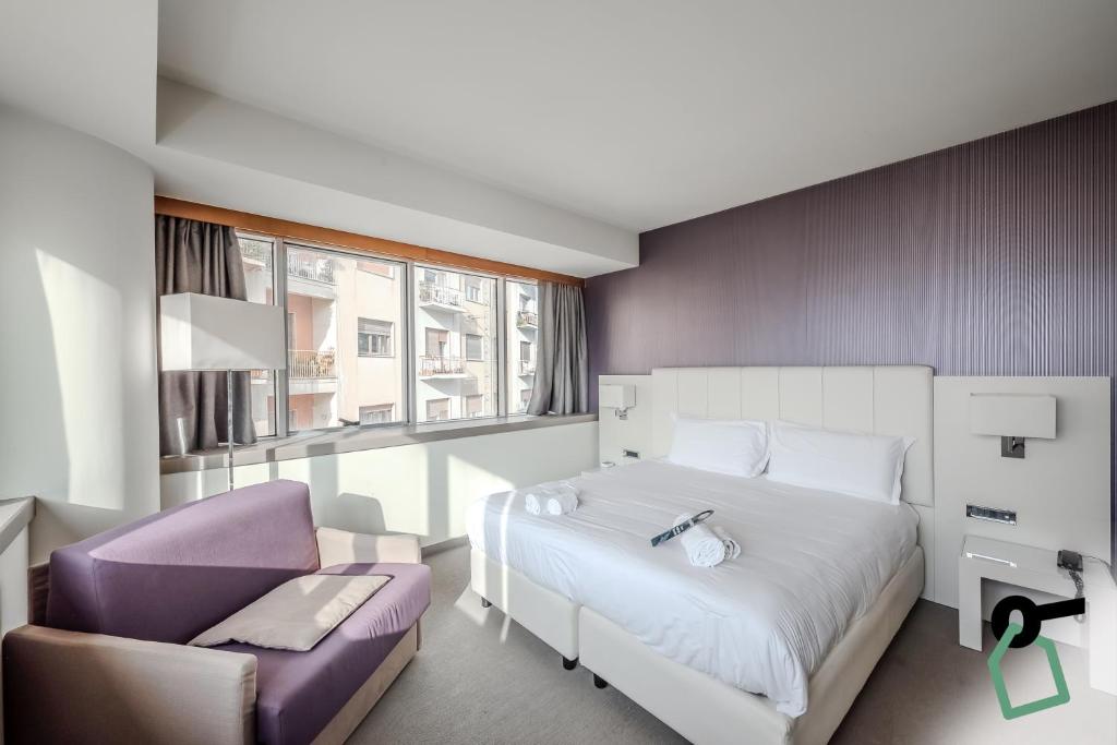 Postel nebo postele na pokoji v ubytování HOTIDAY Room Collection - Trapani