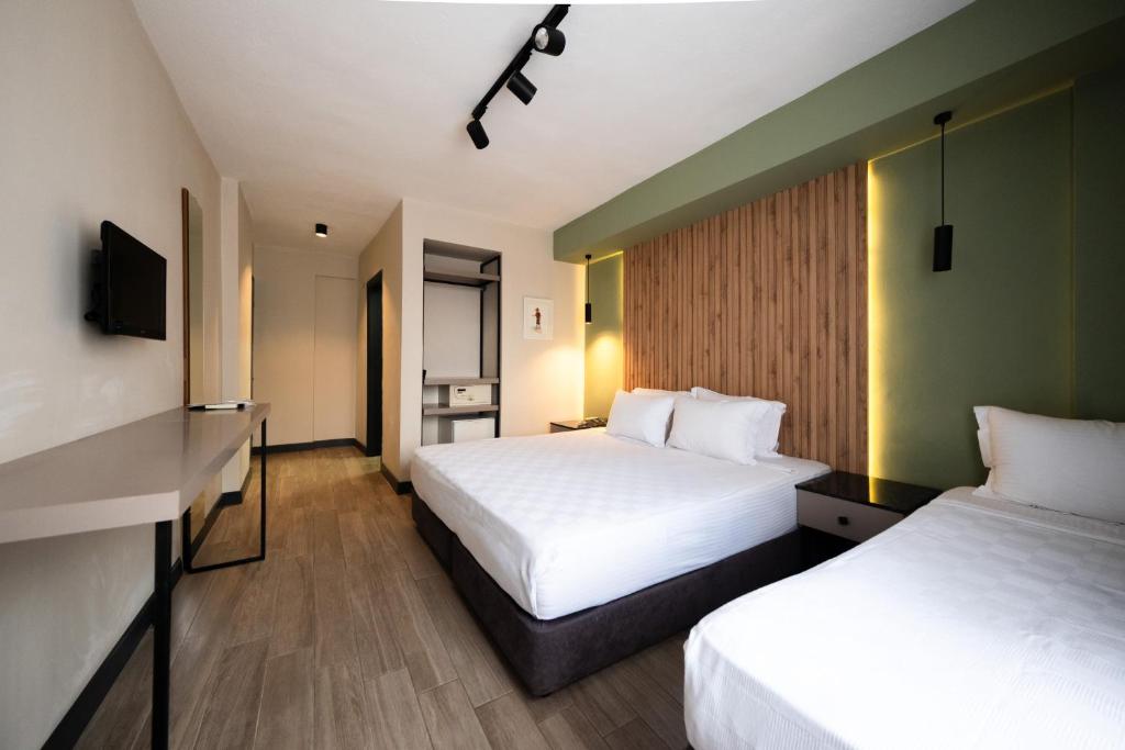 Postel nebo postele na pokoji v ubytování Polek Hotel