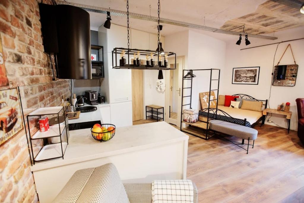 a kitchen and a living room with a table at 3K Kowalska 16 in Lublin