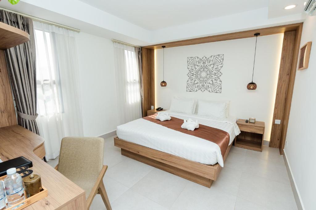 Postel nebo postele na pokoji v ubytování Botum Domrey Hotel