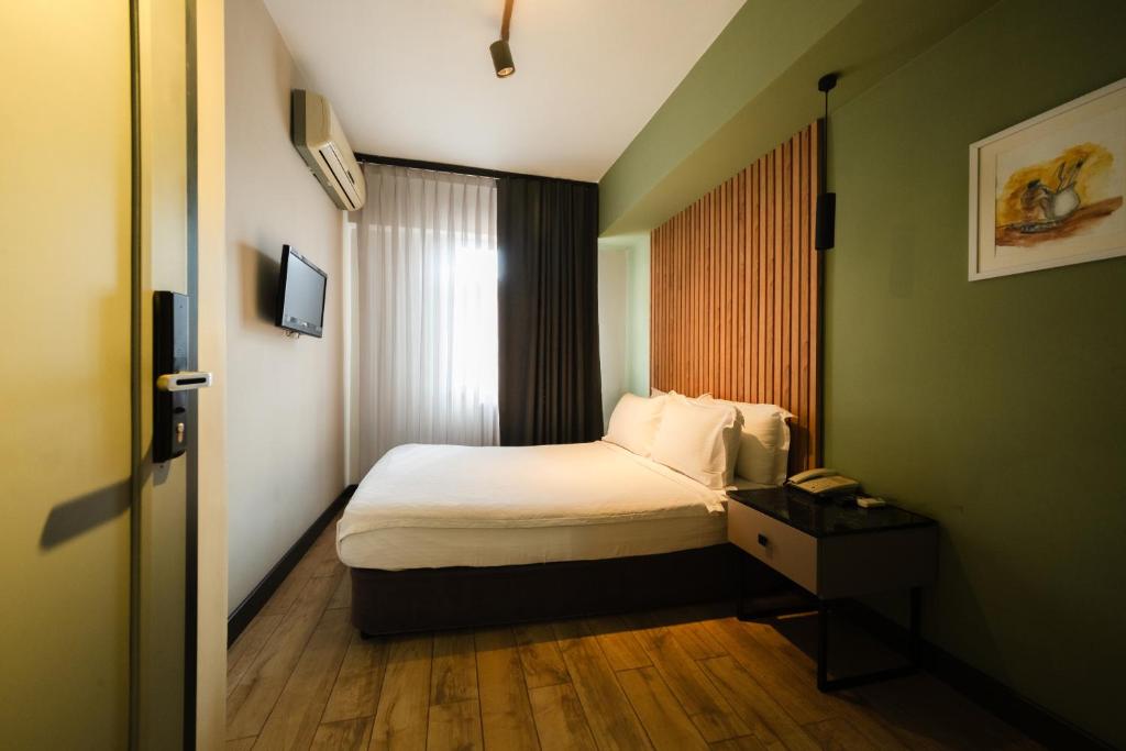 Postel nebo postele na pokoji v ubytování Polek Hotel