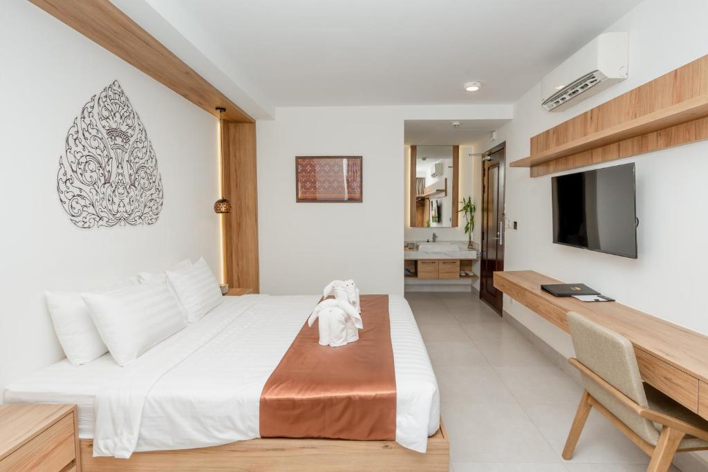 Postel nebo postele na pokoji v ubytování Botum Domrey Hotel