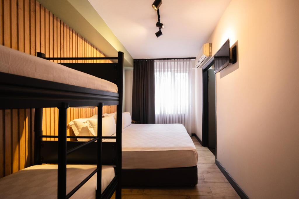 Postel nebo postele na pokoji v ubytování Polek Hotel