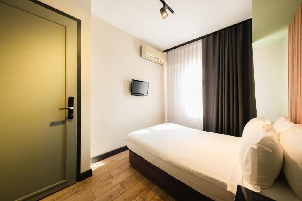 Postel nebo postele na pokoji v ubytování Polek Hotel