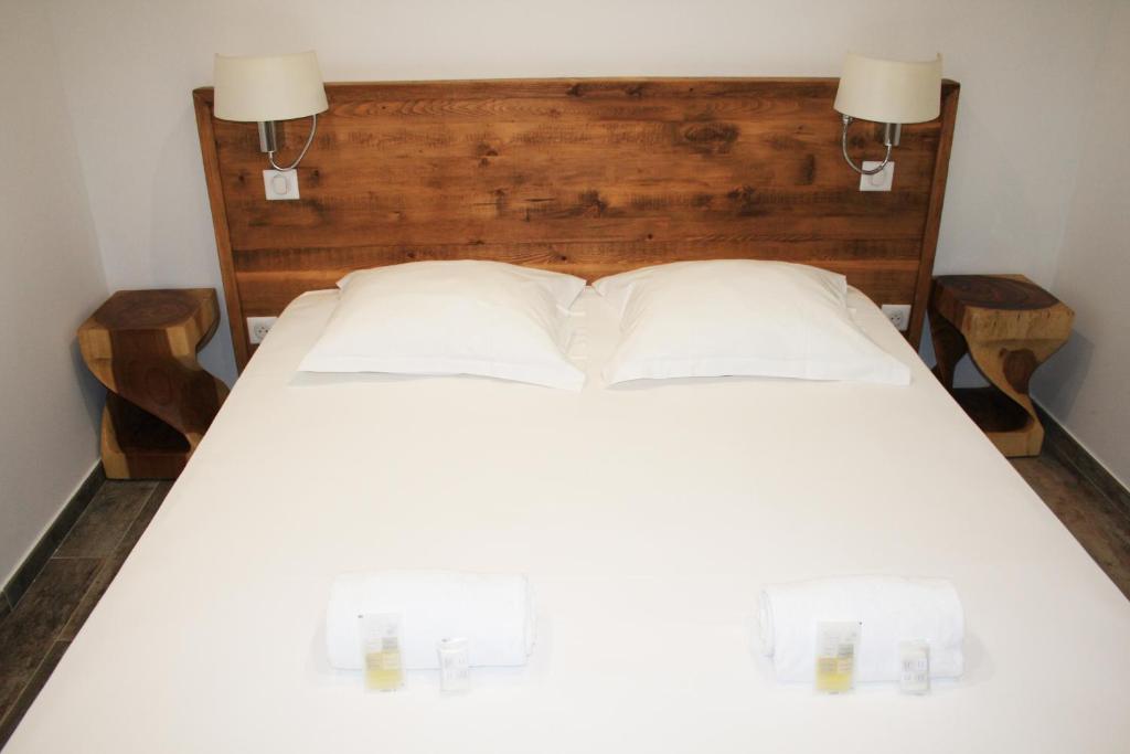 Postel nebo postele na pokoji v ubytování Village de vacances Paese di Lava, Grand Ajaccio