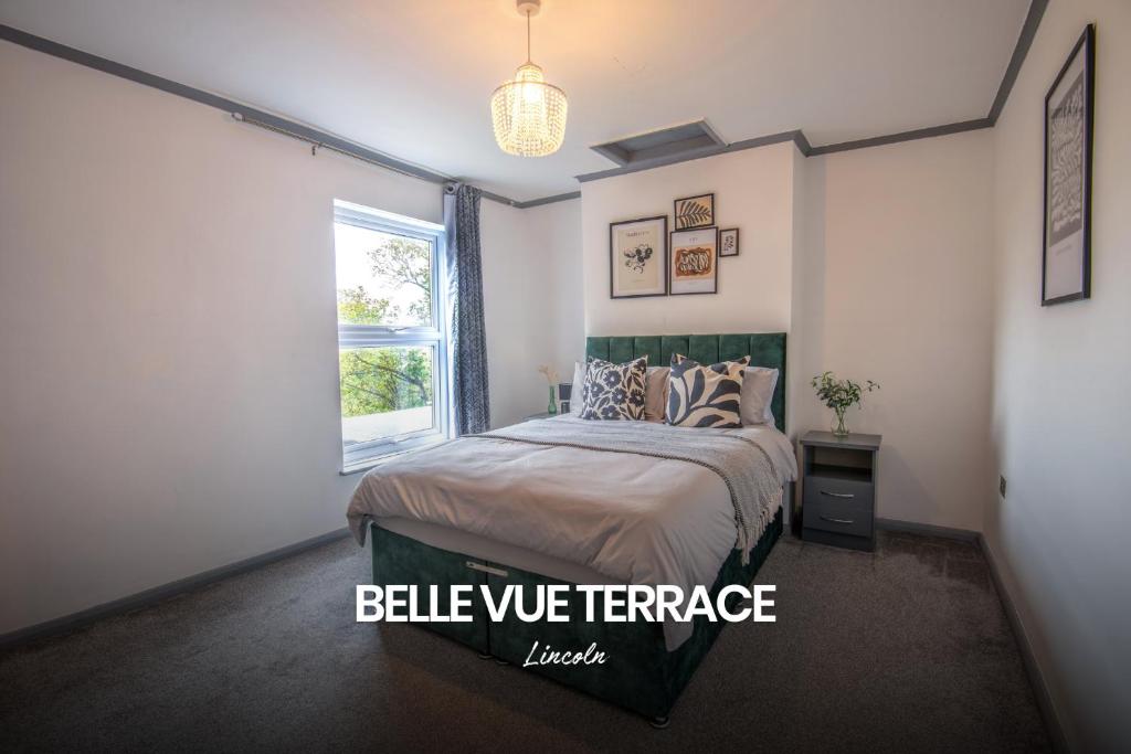 a bedroom with a bed and a window at Bright and Warm Home in Lincoln by Renzo, Free Wi-Fi, Perfect for Staycations! in Lincolnshire