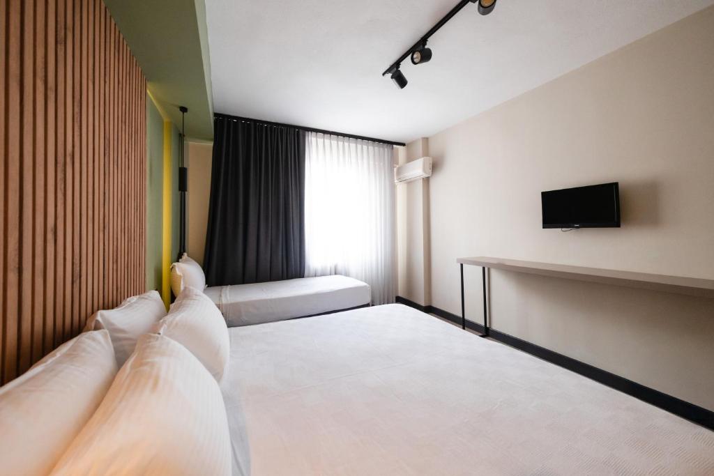 Postel nebo postele na pokoji v ubytování Polek Hotel