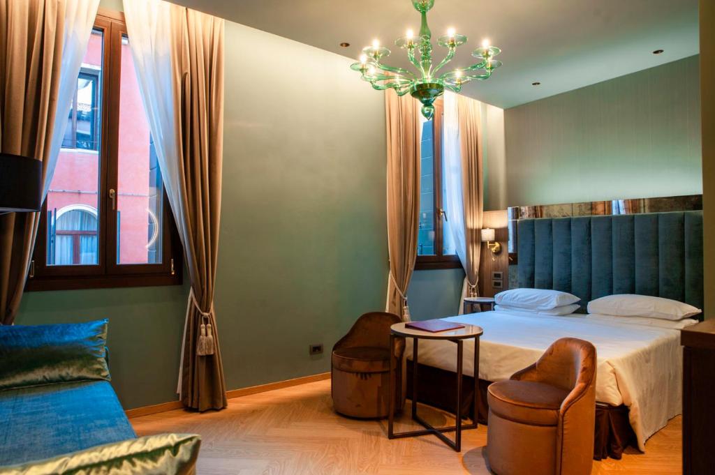 Postel nebo postele na pokoji v ubytování Hotel Campiello