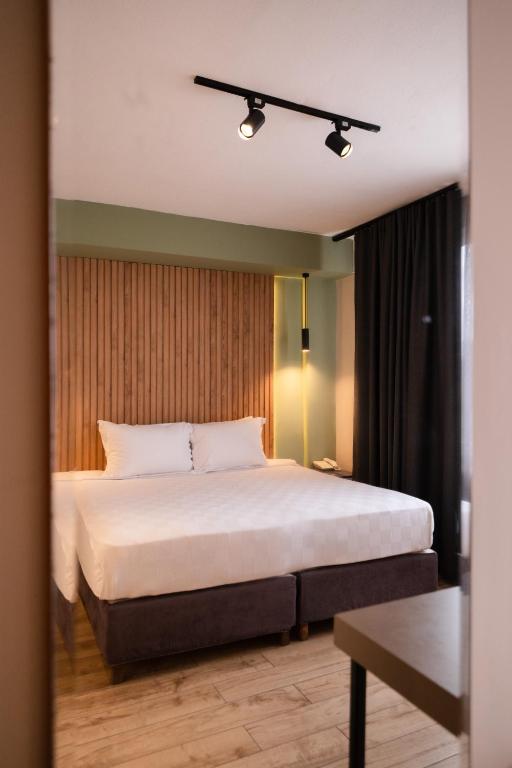 Postel nebo postele na pokoji v ubytování Polek Hotel