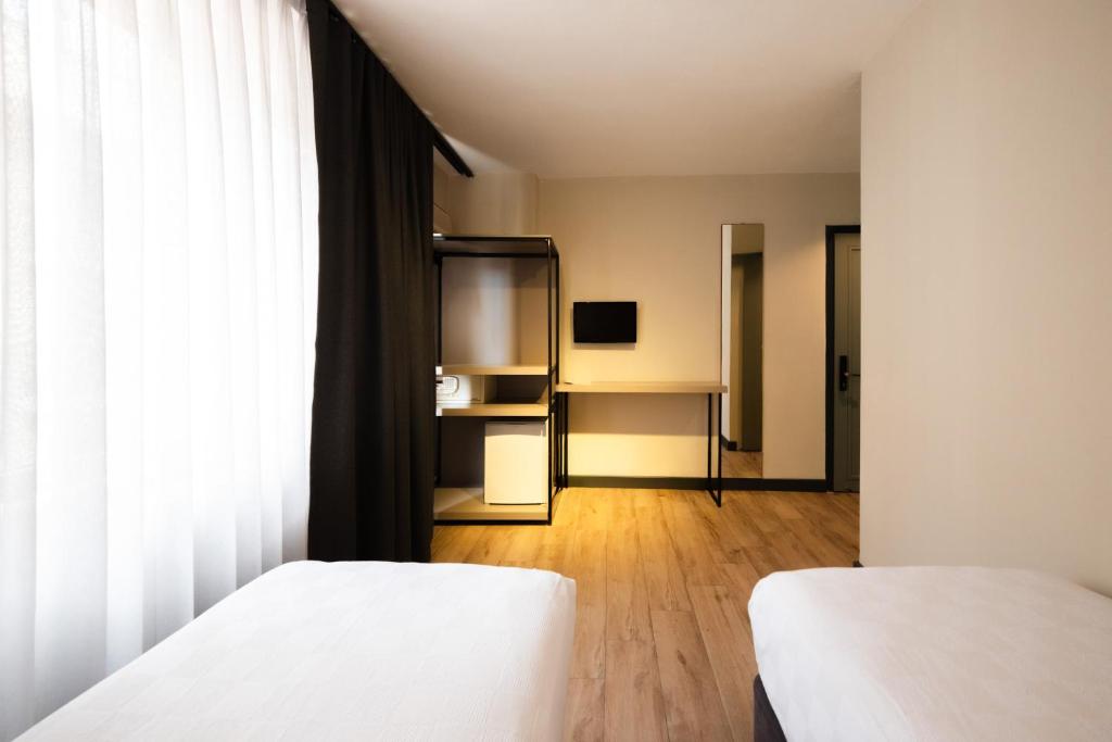 Postel nebo postele na pokoji v ubytování Polek Hotel
