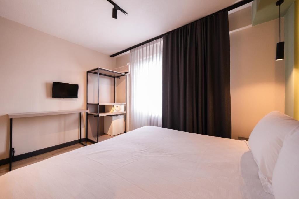 Postel nebo postele na pokoji v ubytování Polek Hotel