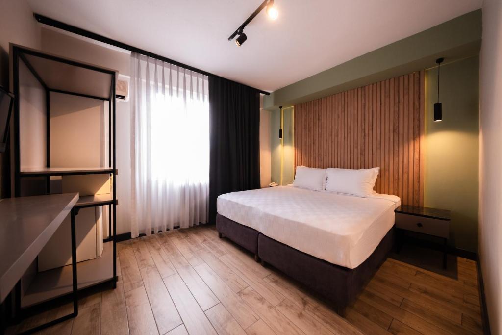 Postel nebo postele na pokoji v ubytování Polek Hotel