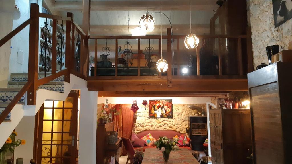 a view of a living room with a couch and lights at Le Mas Nomade in Callian