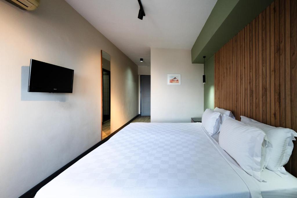 Postel nebo postele na pokoji v ubytování Polek Hotel