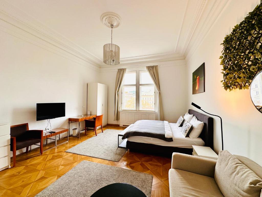 Televízia a/alebo spoločenská miestnosť v ubytovaní Parkview Rudolfsplatz