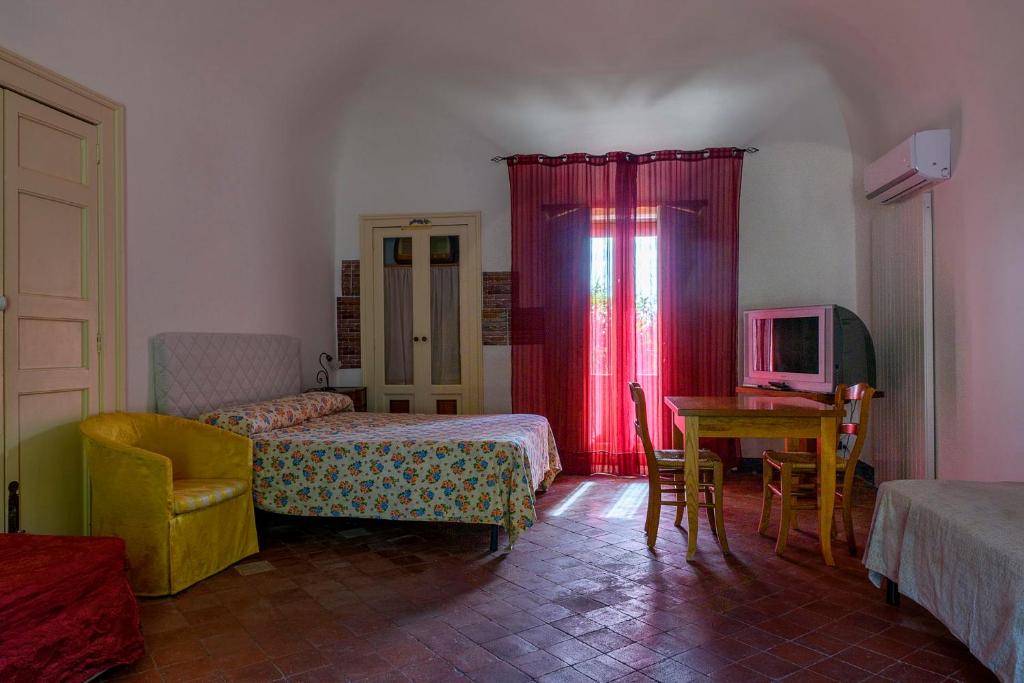 Posteľ alebo postele v izbe v ubytovaní La Pietra Antica O' Munti