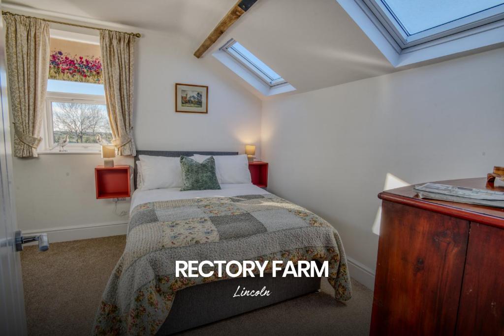 a bedroom with a bed and a window at Spacious and Homely 2-bed Home in Lincoln by Renzo, Stunning Countryside Location, Free Parking! in Stow