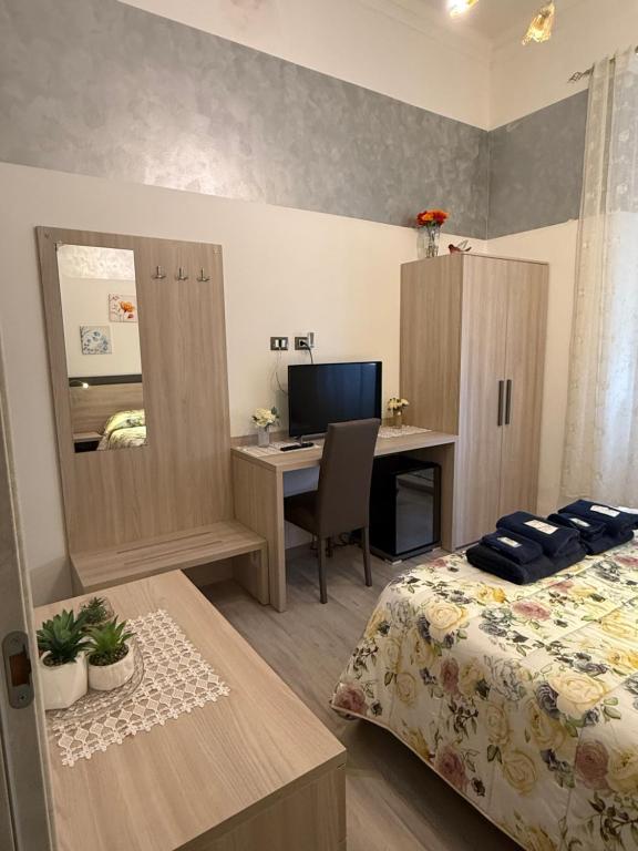 Postel nebo postele na pokoji v ubytování Albergo Astro