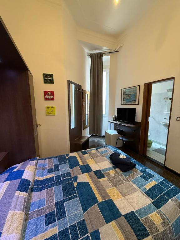 Postel nebo postele na pokoji v ubytování Albergo Astro