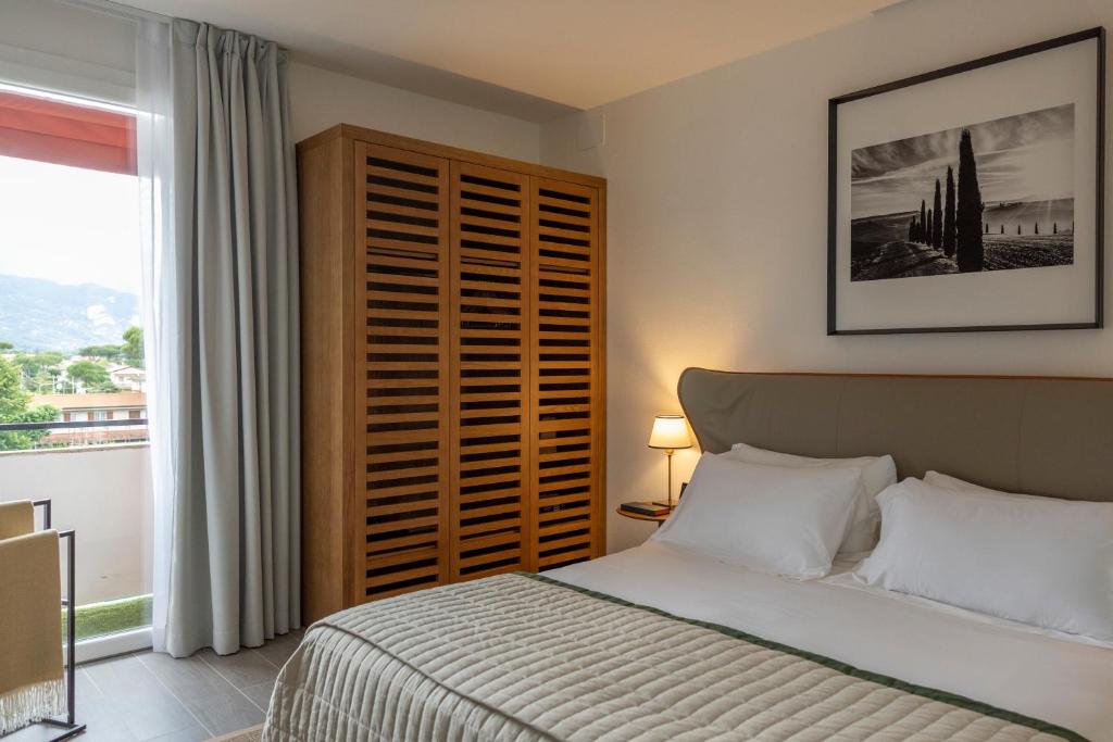 Postel nebo postele na pokoji v ubytování La Serena Hotel FDM