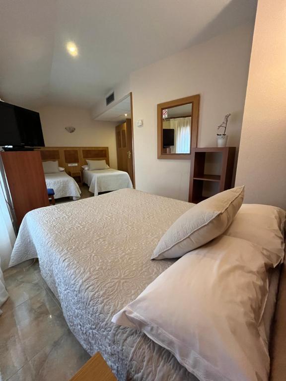 Postel nebo postele na pokoji v ubytování Hostal Azul