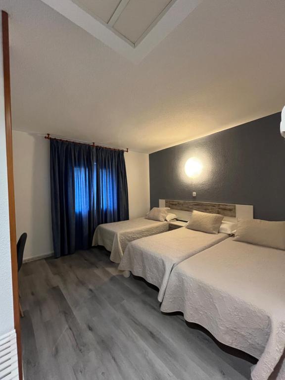 Postel nebo postele na pokoji v ubytování Hostal Azul