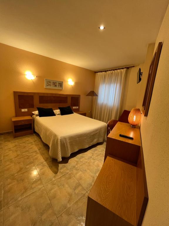 Postel nebo postele na pokoji v ubytování Hostal Azul