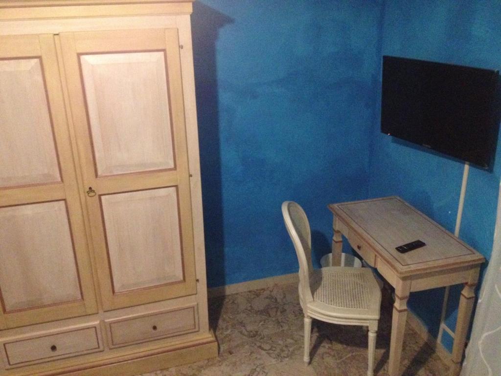 Televízia a/alebo spoločenská miestnosť v ubytovaní Scala Apartment