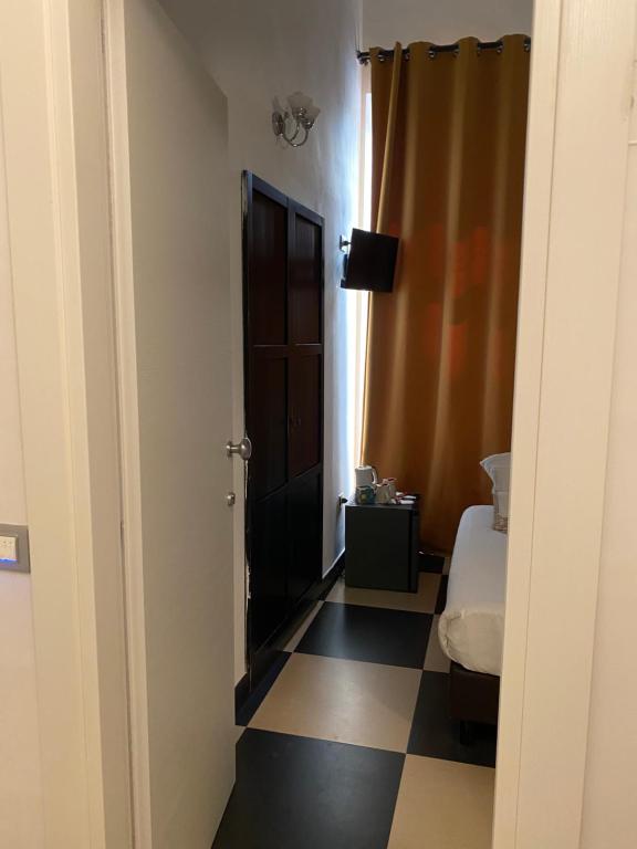 Postel nebo postele na pokoji v ubytování Hotel Plebiscito Aparthotel