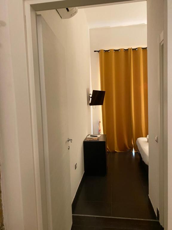 Postel nebo postele na pokoji v ubytování Hotel Plebiscito Aparthotel
