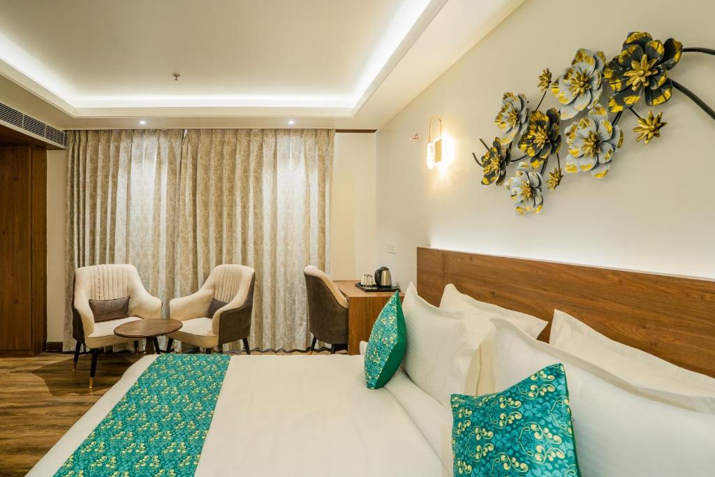Postel nebo postele na pokoji v ubytování Royal Prime - A City Center Boutique Hotel In Jaipur