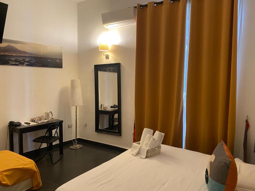 Postel nebo postele na pokoji v ubytování Hotel Plebiscito Aparthotel