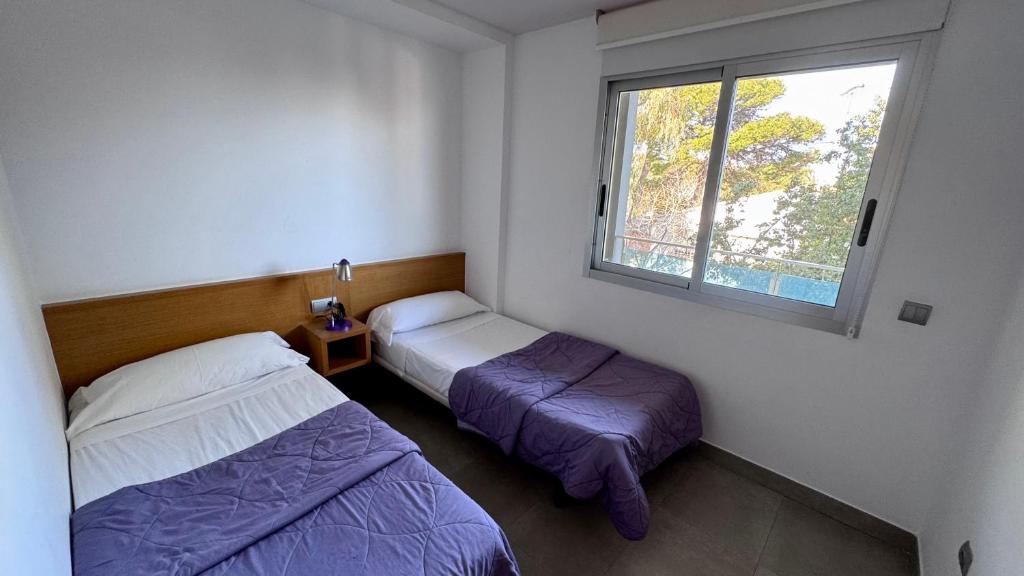 Posteľ alebo postele v izbe v ubytovaní Apartamentos Bravosol VyB