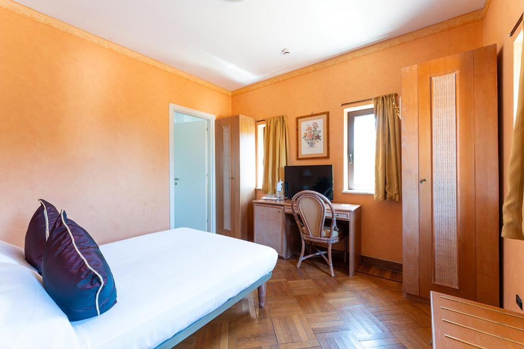 Postel nebo postele na pokoji v ubytování Park Hotel Villa Ariston