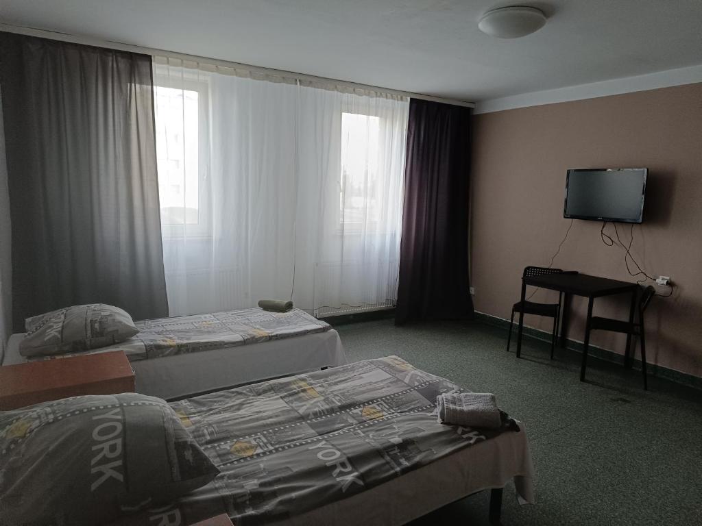Posteľ alebo postele v izbe v ubytovaní Twój Hostel Bytom