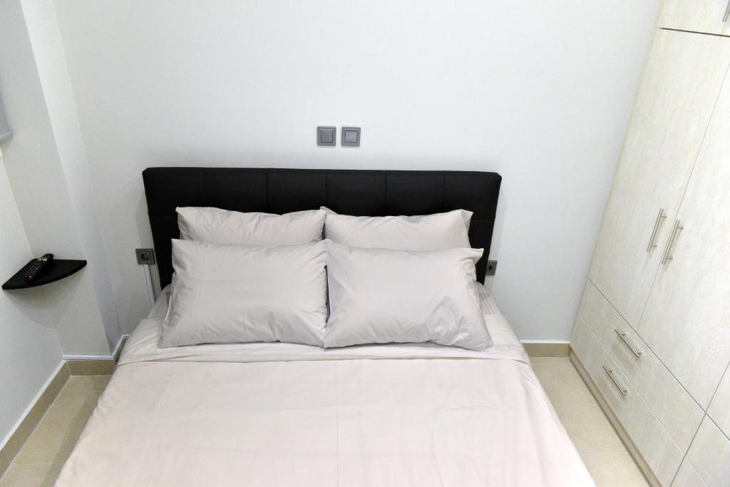 Postel nebo postele na pokoji v ubytování Krya Suites