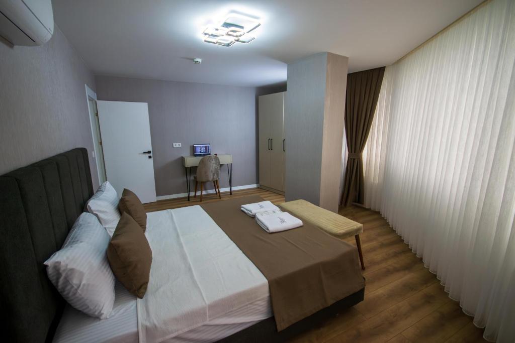 a hotel room with a bed and a table at Luxury Life Suites in Istanbul