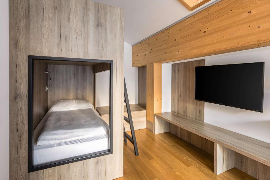 Postel nebo postele na pokoji v ubytování NH Collection Alagna Mirtillo Rosso