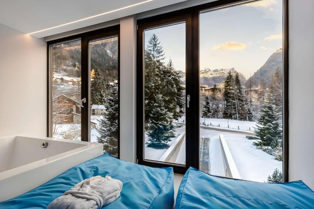 Postel nebo postele na pokoji v ubytování NH Collection Alagna Mirtillo Rosso