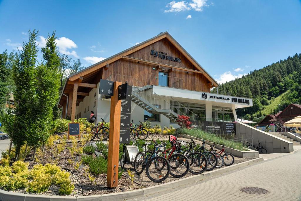 a group of bikes parked in front of a building at Willa Pod Kolejką in Szczawnica