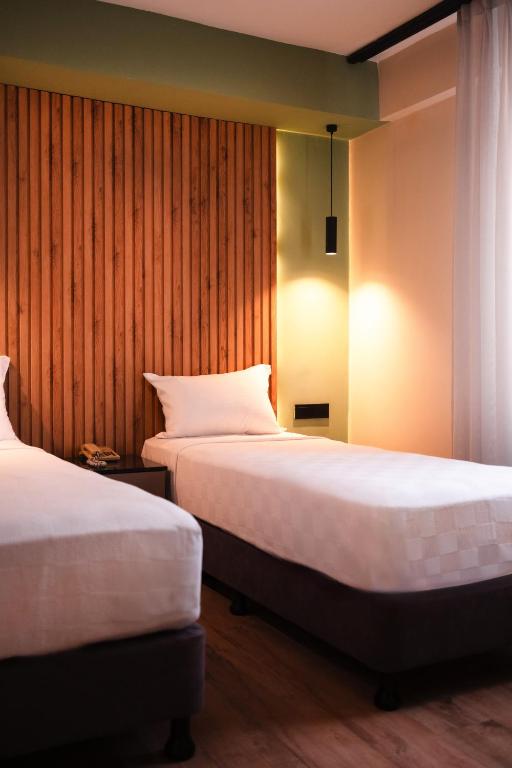 Postel nebo postele na pokoji v ubytování Polek Hotel