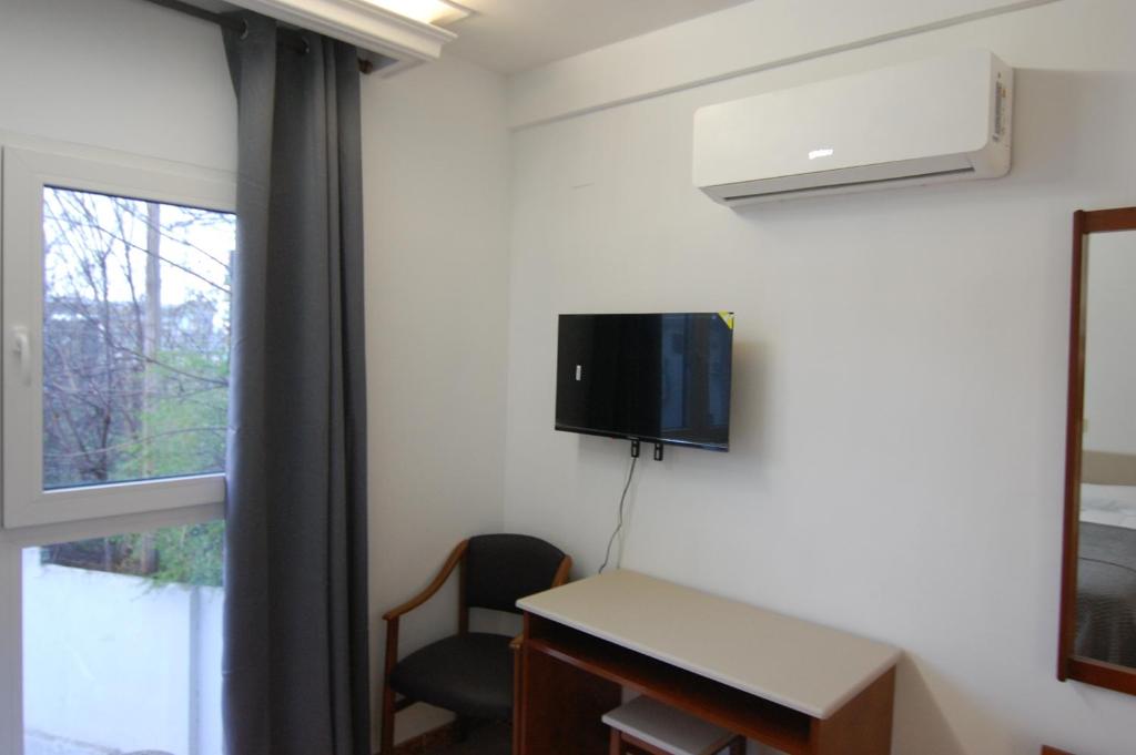 TV a/nebo společenská místnost v ubytování El Hostal 36
