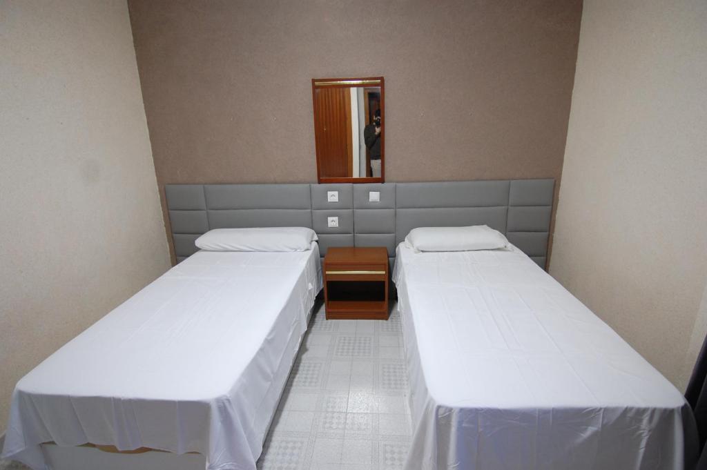 Postel nebo postele na pokoji v ubytování El Hostal 36