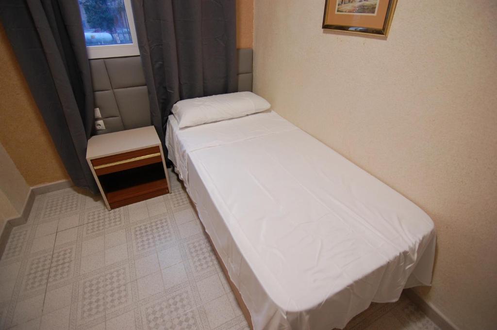 Postel nebo postele na pokoji v ubytování El Hostal 36