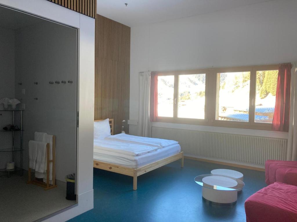 Postel nebo postele na pokoji v ubytování Shima-Davos