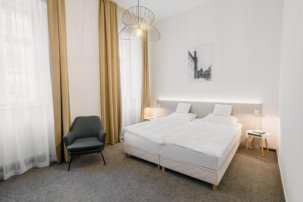 Postel nebo postele na pokoji v ubytování Hotel Benedict
