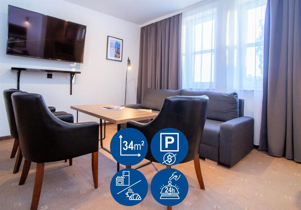 Televízia a/alebo spoločenská miestnosť v ubytovaní Warsaw Apartments - Apartamenty Sadyba