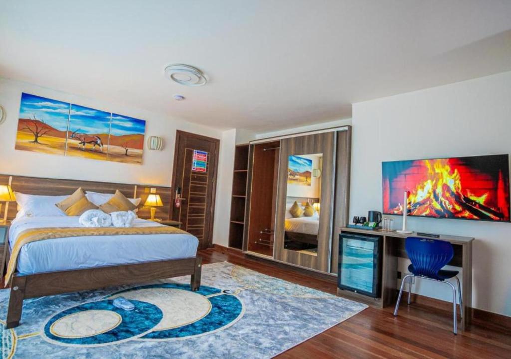 Postel nebo postele na pokoji v ubytování Light Villas Gigiri
