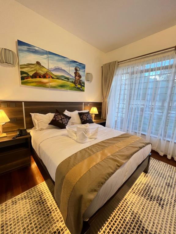 Postel nebo postele na pokoji v ubytování Light Villas Gigiri